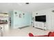 Open concept living room with a view into the dining area at 817 E 6Th St, Englewood, FL 34223