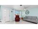 Bright living room with light walls, comfortable seating, and a ceiling fan at 817 E 6Th St, Englewood, FL 34223