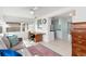 Bright sunroom features a comfy couch,workspace, and view of the backyard at 817 E 6Th St, Englewood, FL 34223