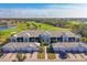 Aerial view of community with golf course in background at 14070 Heritage Landing Blvd # 423, Punta Gorda, FL 33955