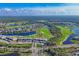 Aerial view of community with golf course and waterfront properties at 14070 Heritage Landing Blvd # 423, Punta Gorda, FL 33955