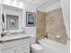 Clean bathroom, bathtub, granite countertop, and updated fixtures at 14070 Heritage Landing Blvd # 423, Punta Gorda, FL 33955