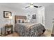 Cozy bedroom with ceiling fan and neutral bedding at 14070 Heritage Landing Blvd # 423, Punta Gorda, FL 33955