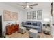 Relaxing den with gray sofa and world map art at 14070 Heritage Landing Blvd # 423, Punta Gorda, FL 33955