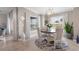 Bright dining area features a round table and four chairs at 14070 Heritage Landing Blvd # 423, Punta Gorda, FL 33955