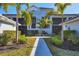 Building exterior showcasing walkway and landscaping at 14070 Heritage Landing Blvd # 423, Punta Gorda, FL 33955