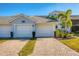 Two-car garage with paver driveway at 14070 Heritage Landing Blvd # 423, Punta Gorda, FL 33955