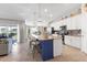 Modern kitchen with island and white cabinets at 14070 Heritage Landing Blvd # 423, Punta Gorda, FL 33955