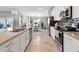 Modern kitchen featuring granite countertops and white cabinets at 14070 Heritage Landing Blvd # 423, Punta Gorda, FL 33955
