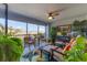 Spacious screened balcony with seating and tropical plants at 14070 Heritage Landing Blvd # 423, Punta Gorda, FL 33955