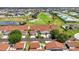 Aerial view of a community featuring lush landscaping, a golf course, and a swimming pool at 1640 Atares Dr # 6, Punta Gorda, FL 33950