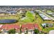 Aerial view of townhomes overlooking a golf course and lakes, offering a blend of recreation and relaxation at 1640 Atares Dr # 6, Punta Gorda, FL 33950