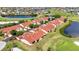 A captivating aerial shot of a townhome community with a golf course and beautiful water features at 1640 Atares Dr # 6, Punta Gorda, FL 33950