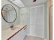 Bathroom with vanity and mirror, closet, and glass door shower stall at 1640 Atares Dr # 6, Punta Gorda, FL 33950