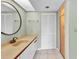 Bathroom with vanity and mirror, closet, and glass door shower stall at 1640 Atares Dr # 6, Punta Gorda, FL 33950