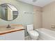 Bathroom features vanity and sink, toilet, bathtub and shower combination at 1640 Atares Dr # 6, Punta Gorda, FL 33950