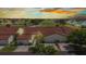 Inviting townhome featuring a red tile roof, attached garage, palm trees, and well-maintained landscaping at 1640 Atares Dr # 6, Punta Gorda, FL 33950