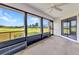 Enclosed patio with ceiling fan overlooks a green lawn and blue skies at 1640 Atares Dr # 6, Punta Gorda, FL 33950