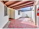 A cozy outdoor patio with a brick floor and a partially covered ceiling at 1640 Atares Dr # 6, Punta Gorda, FL 33950