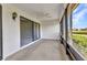 Enclosed porch with carpet flooring, ceiling fan, and screened windows at 1640 Atares Dr # 6, Punta Gorda, FL 33950