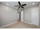 Bright bedroom featuring wood-look floors and ceiling fan at 180 W Pine Valley Ln, Rotonda West, FL 33947