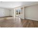 Bright Gathering room with wood-look floors and French doors opening to the pool at 20191 Gladstone Ave, Port Charlotte, FL 33952