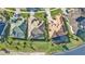 Bird's eye view of upscale homes with tile roofs and landscaping at 2163 Silver Palm Rd, North Port, FL 34288