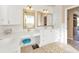 Elegant bathroom with double vanity, large mirrors, and a tranquil atmosphere at 2163 Silver Palm Rd, North Port, FL 34288