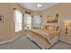 Spacious bedroom with a king-size bed and bay window at 2163 Silver Palm Rd, North Port, FL 34288