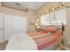 Bright bedroom with a queen-size bed and ample closet space at 2163 Silver Palm Rd, North Port, FL 34288