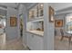 Bright kitchen nook with glass-top table and floral chairs, overlooking the backyard at 2163 Silver Palm Rd, North Port, FL 34288