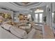 Open living room with sectional sofa and view to entryway at 2163 Silver Palm Rd, North Port, FL 34288