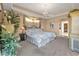 Comfortable main bedroom with king-size bed and views of the backyard at 2163 Silver Palm Rd, North Port, FL 34288