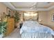 Spacious main bedroom with king-size bed and ample natural light at 2163 Silver Palm Rd, North Port, FL 34288