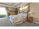 Relaxing main bedroom with a king-size bed and access to the private patio at 2163 Silver Palm Rd, North Port, FL 34288