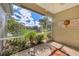 Bright screened porch with pond view at 2485 Magnolia Cir, North Port, FL 34289