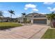 Beautiful single-Gathering home with a large driveway and landscaping at 303 Paramaribo St, Punta Gorda, FL 33983