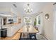 Open concept dining room and kitchen, showcasing a farmhouse table at 340 Carmel Rd, Venice, FL 34293