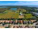 Neighborhood overview showcasing houses and surrounding landscape at 4261 River Bank Way, Punta Gorda, FL 33980