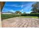 Large brick paved patio, surrounded by hedges at 4261 River Bank Way, Punta Gorda, FL 33980