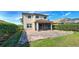 Brick paved backyard patio with screened enclosure at 4261 River Bank Way, Punta Gorda, FL 33980