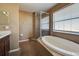 Bathroom features a garden tub, shower, and double vanity at 4261 River Bank Way, Punta Gorda, FL 33980