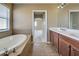Primary bathroom with soaking tub and double vanity at 4261 River Bank Way, Punta Gorda, FL 33980