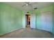 Light green bedroom with carpet and double door closet at 4261 River Bank Way, Punta Gorda, FL 33980
