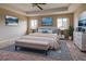 Primary bedroom with a king-size bed and stylish decor at 4261 River Bank Way, Punta Gorda, FL 33980