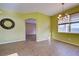 Bright dining room with tile floors and view into adjacent living area at 4261 River Bank Way, Punta Gorda, FL 33980