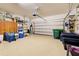 Two-car garage with built-in shelving and storage at 4261 River Bank Way, Punta Gorda, FL 33980