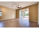 Gathering room with sliding doors to patio and tile floors at 4261 River Bank Way, Punta Gorda, FL 33980
