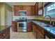 Kitchen with stainless steel appliances and granite countertops at 4261 River Bank Way, Punta Gorda, FL 33980