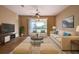 Living room with patio access, comfy seating, and large TV at 4261 River Bank Way, Punta Gorda, FL 33980